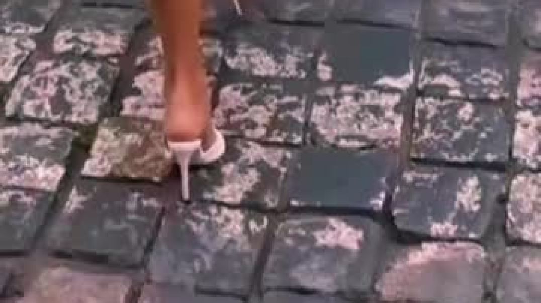 white mules on cobblestones