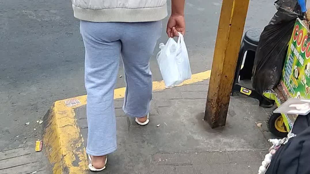 Woman walking in crushed flats