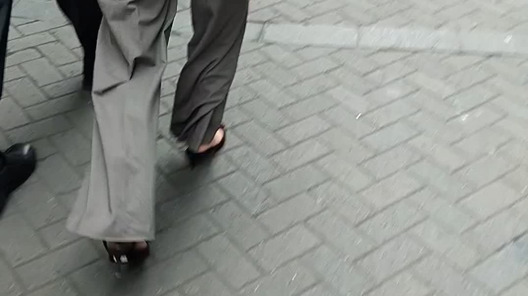 Lady blonde walking in loose straps slingbacks
