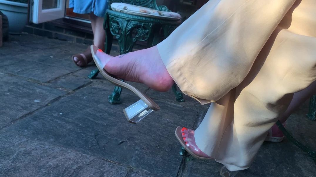 Girlfriend dangling her clear mules 2