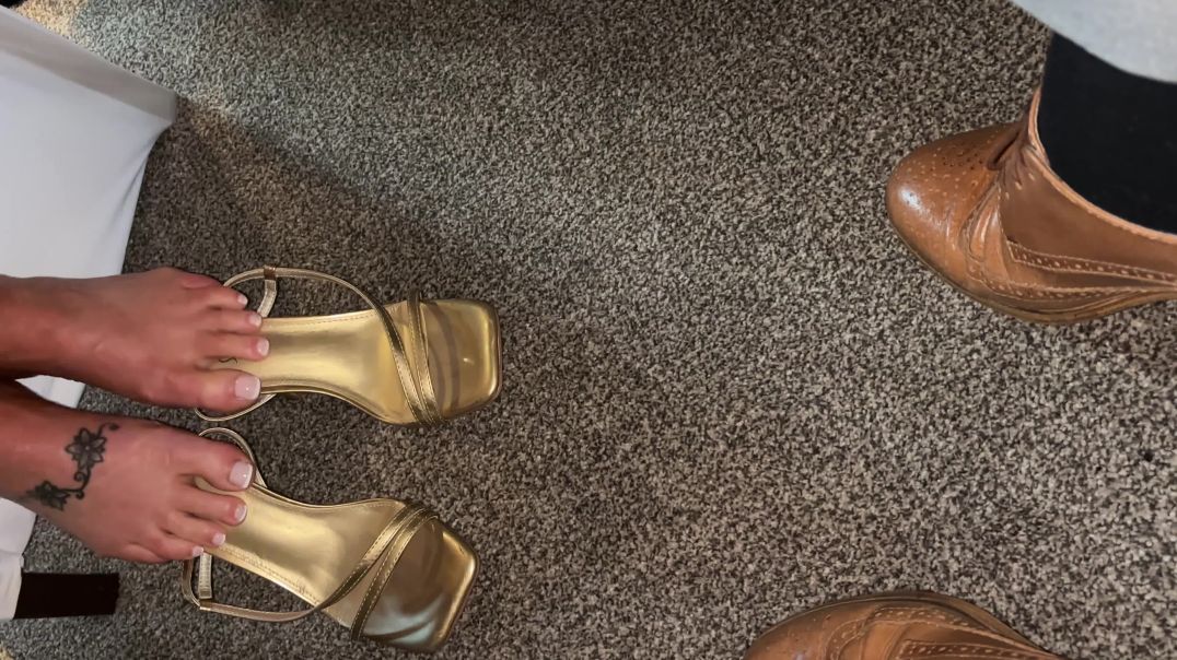 wifes feet in strappy heels