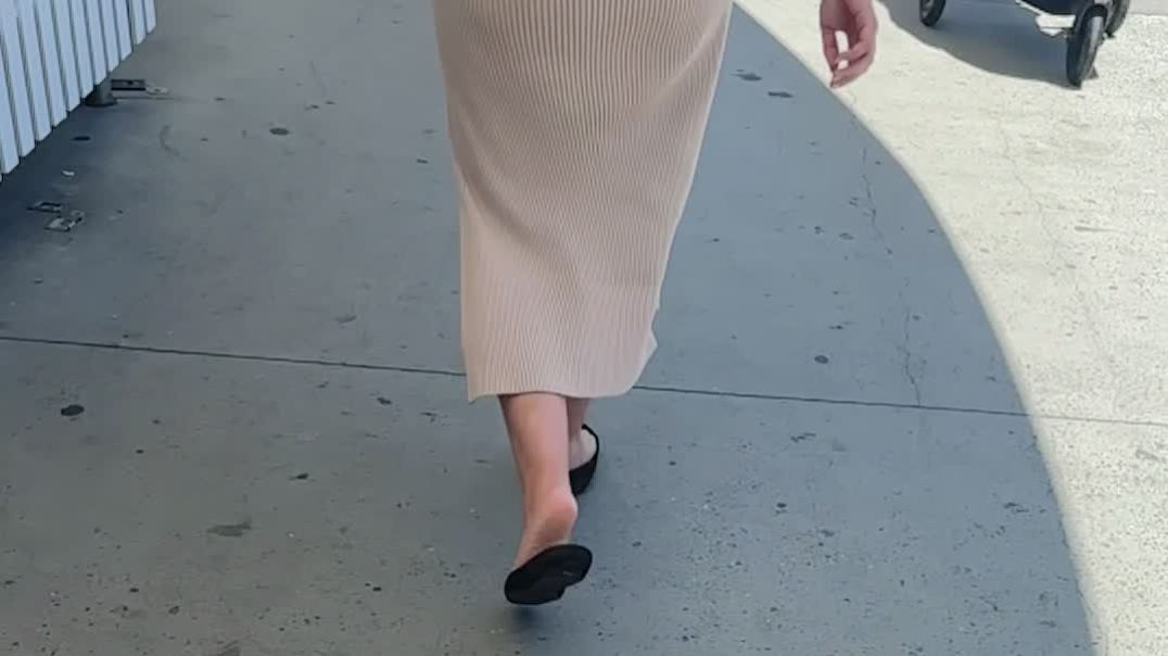 Still wearing her crushed D’orsays