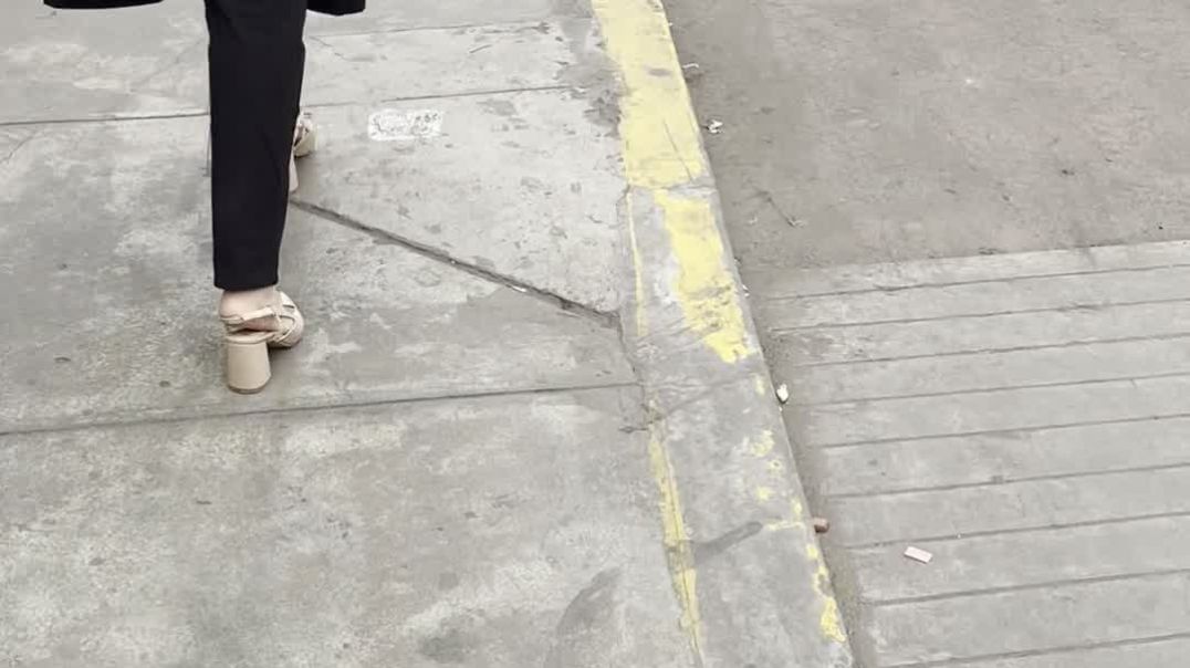 Other woman walking in loose slingbacks heels