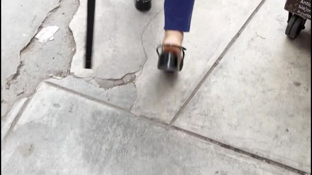 The right strap of this heel is too loose for this woman