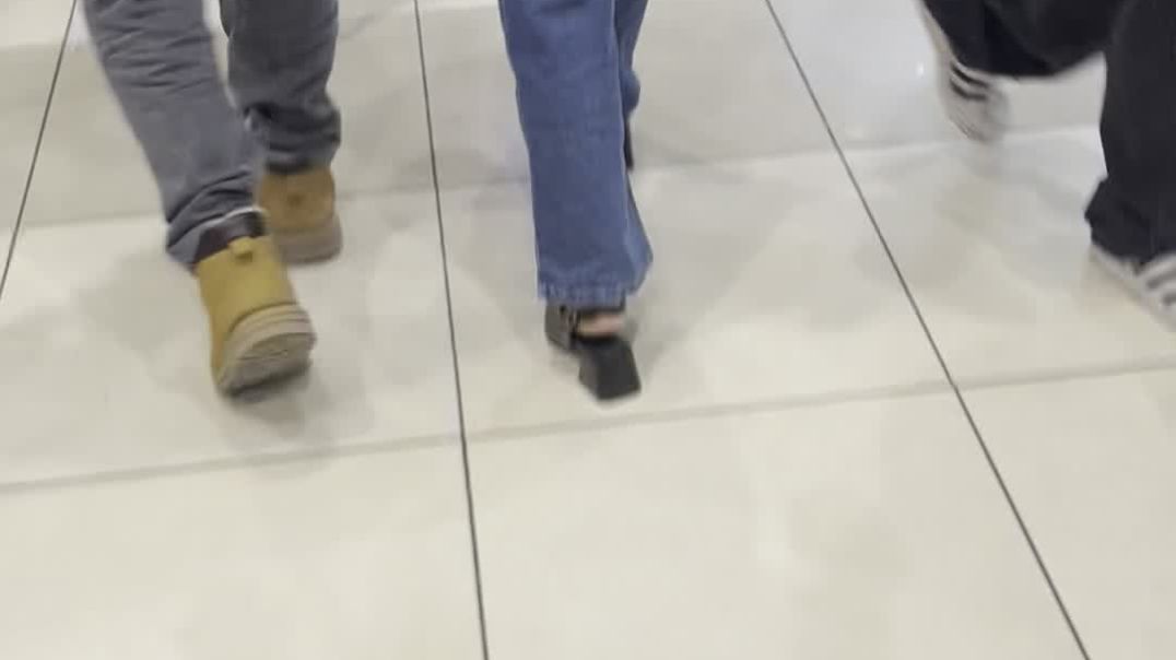 The girlfriend of someone with very big slingback heels