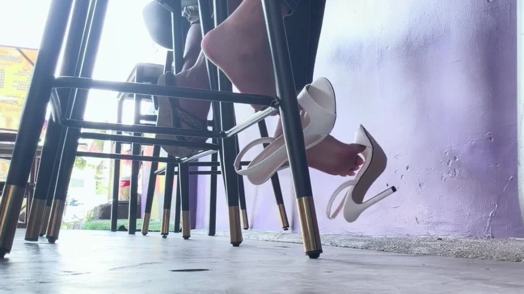 dangling high-heeled shoes