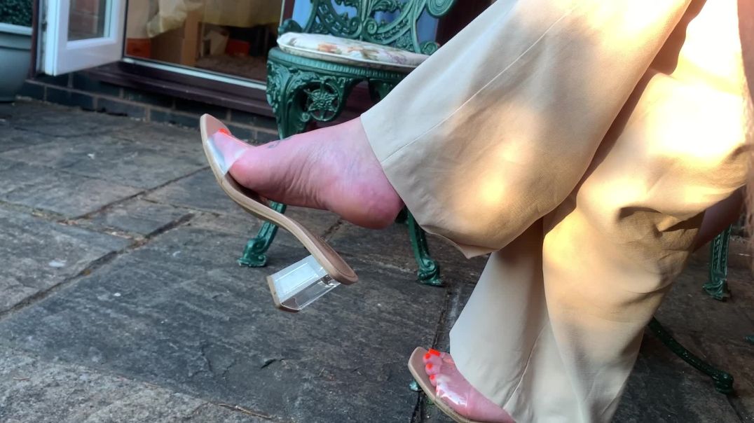 Girlfriend dangling her clear mules 2