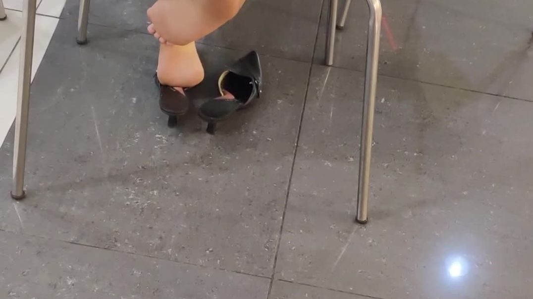 candid shoeplay in black mules