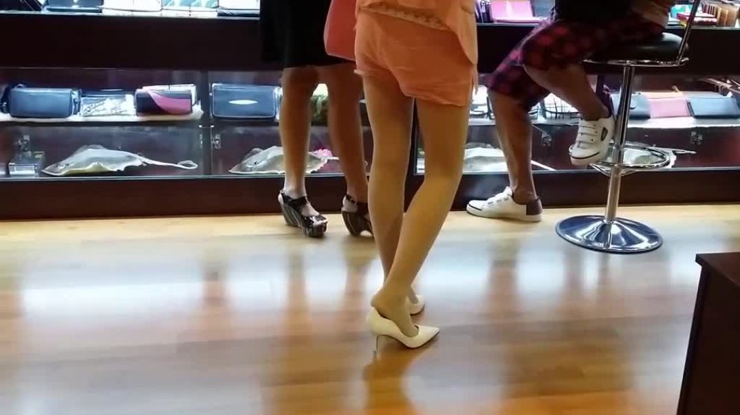 candid shoeplay in white pumps