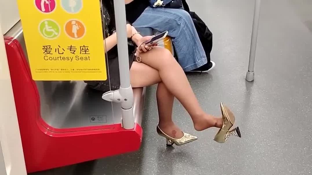 candid dangling sexy shoes in subway